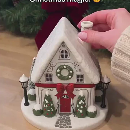 Buckingham Cottage light-up Christmas village diffuser with glowing windows and chimney mist